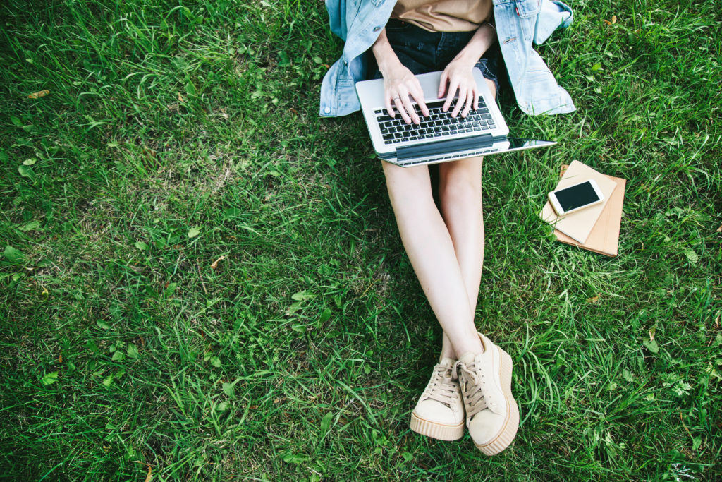 Woman On Laptop On Grass | Stress Support