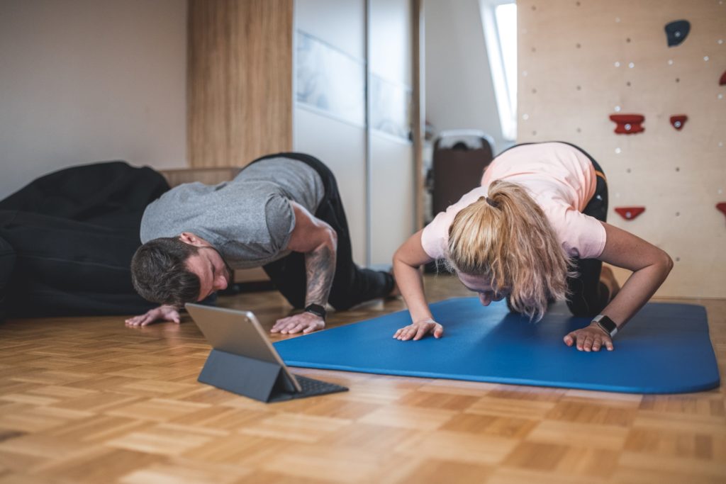 A couple exercising at home