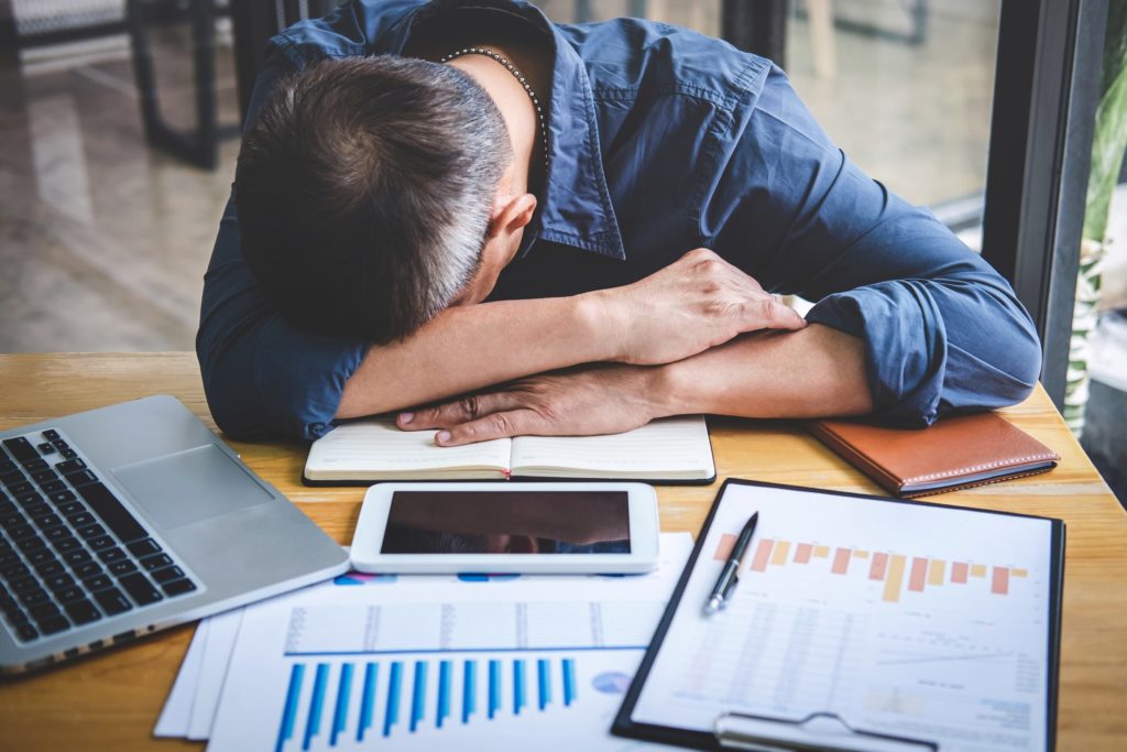 man asleep at desk